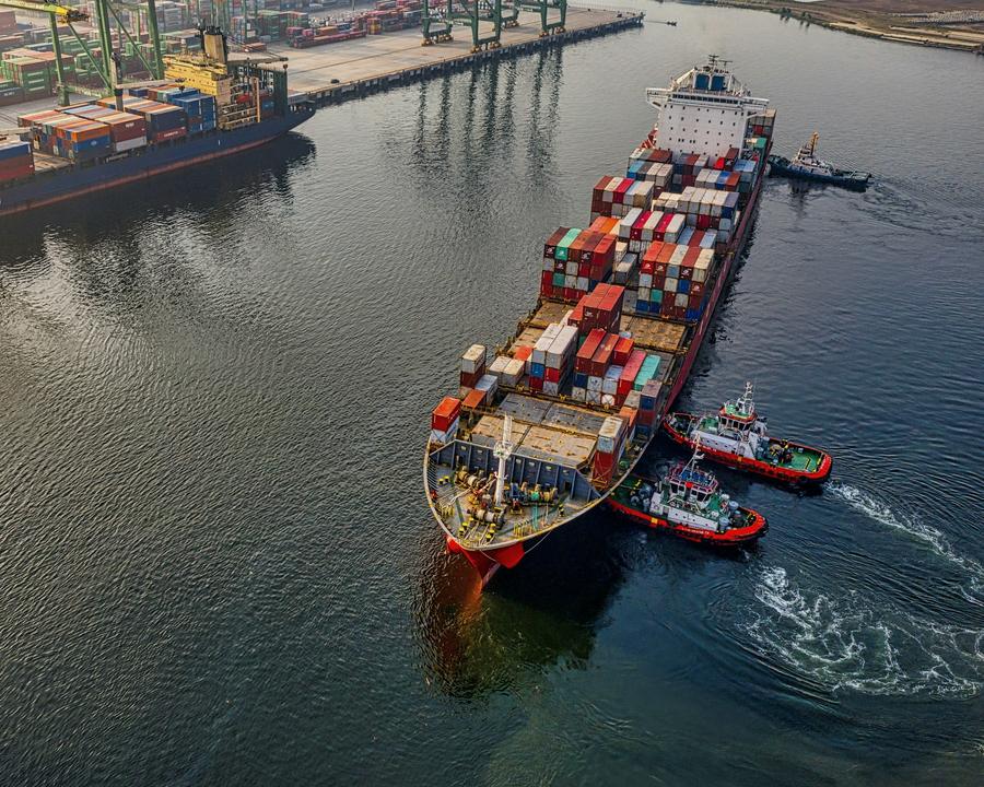 Container ship loaded with containers under way at sea