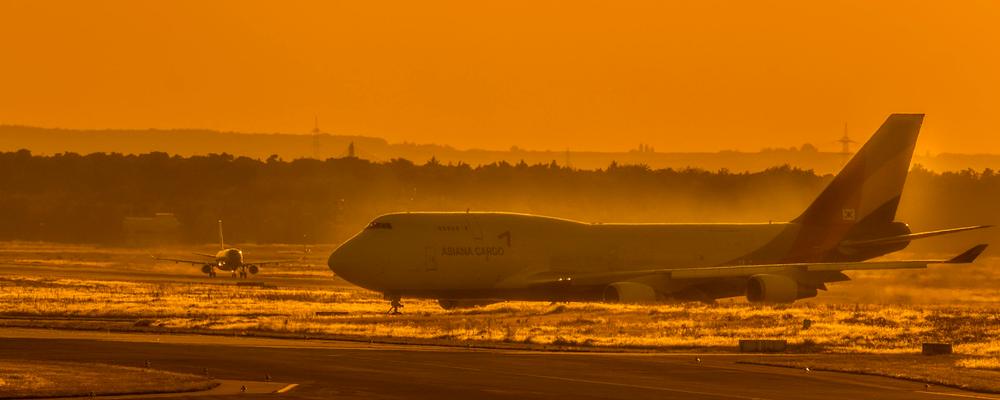 Freight aircraft on the apron at sunset