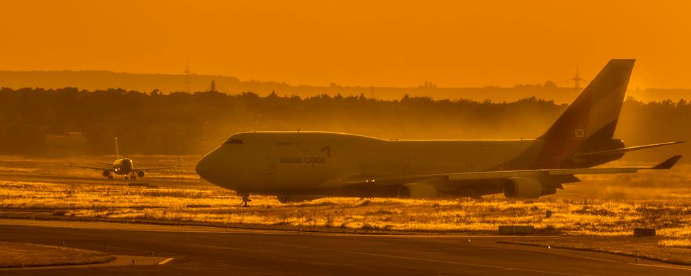 Freight aircraft on the apron at sunset